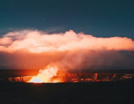 Bonfire against white clouds - Hawaiian’s most active volcano in Big Island.