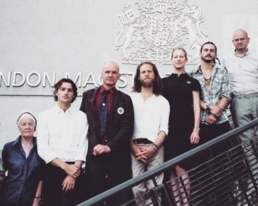 Mark Øvland (center) with the rest of the "Petroleum 9" at Hendon Magistrates' Court. © Sophie Cowen